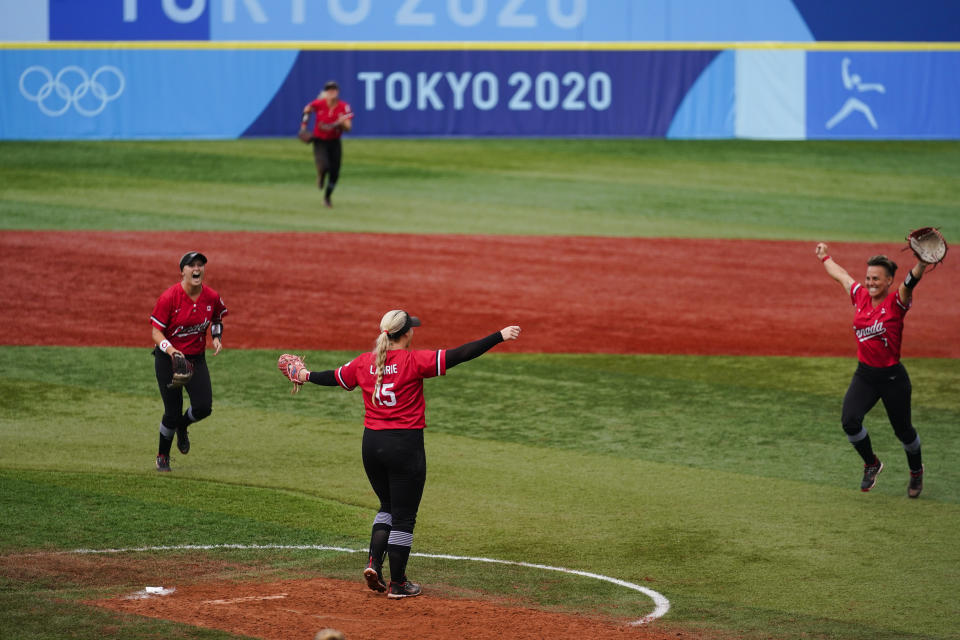 Canada's Janet Leung (15) celebrate after a softball game against Mexico at the 2020 Summer Olympics, Tuesday, July 27, 2021, in Yokohama, Japan. Canada won 3-2. (AP Photo/Matt Slocum)