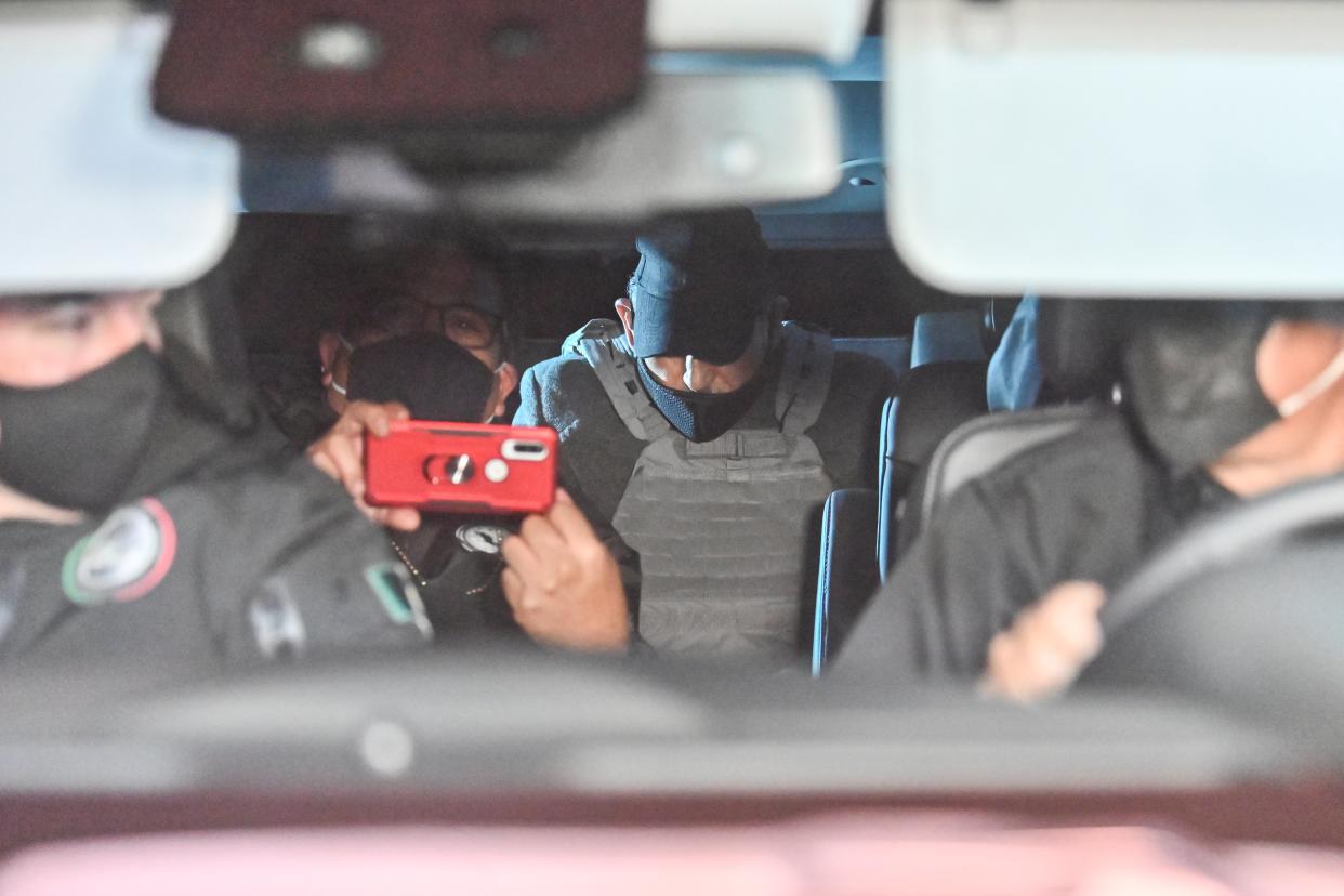 An unidentified person with a vest is seen in a convoy transporting the former chief executive of Mexico's state oil company PEMEX, Emilio Lozoya, to the General Attorney office following his extradition from Spain, in Mexico City on July 17, 2020. - Lozoya, PEMEX chief from 2012 to 2018, is accused of accepting millions of dollars in bribes from scandal-tainted Brazilian construction giant Odebrecht. (Photo by Pedro PARDO / AFP) / The erroneous mention appearing in the metadata of this photo by PEDRO PARDO has been modified in AFP systems in the following manner: [An unidentified person with a vest is seen in a convoy transporting the former chief executive of Mexico's state oil company PEMEX, Emilio Lozoya,...] instead of [Emilio Lozoya, former chief executive of Mexico's state oil company PEMEX, is seen...]. Please immediately remove the erroneous mention from all your online services and delete it from your servers. If you have been authorized by AFP to distribute it (them) to third parties, please ensure that the same actions are carried out by them. Failure to promptly comply with these instructions will entail liability on your part for any continued or post notification usage. Therefore we thank you very much for all your attention and prompt action. We are sorry for the inconvenience this notification may cause and remain at your disposal for any further information you may require. (Photo by PEDRO PARDO/AFP via Getty Images)