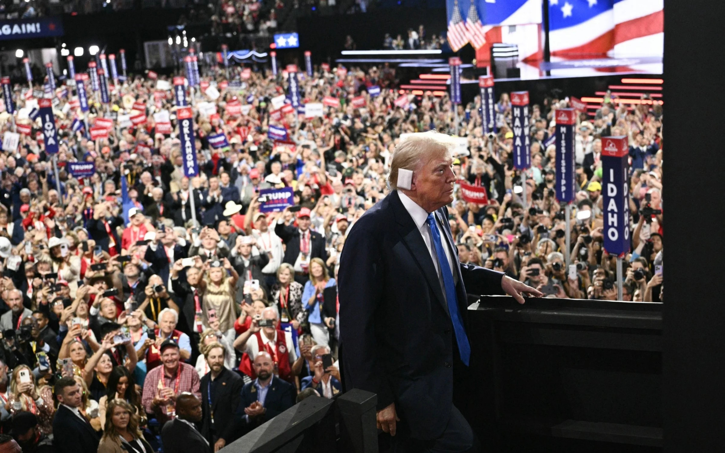 Trump took to the stage displaying a bandage on his ear after the assassination attempt at the weekend