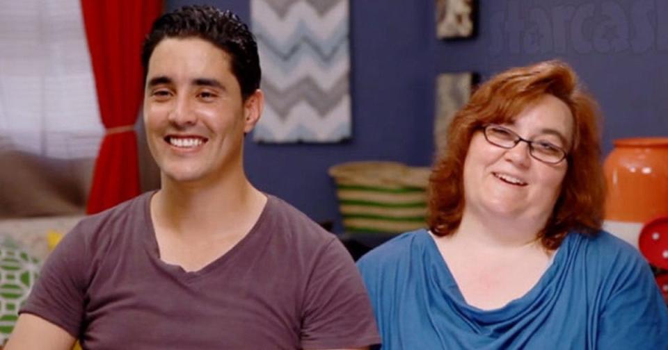 Mohamed Jbali and Danielle Mullins sitting in front of the camera on set of '90 day fiance'