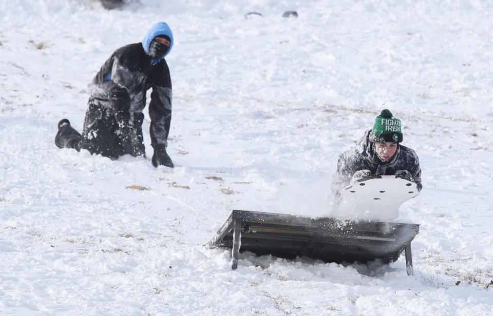 Adventurous sledders brought their own ramp to Brandywine Creek State Park after a winter storm passed through north Delaware, Saturday, Jan. 29, 2022.