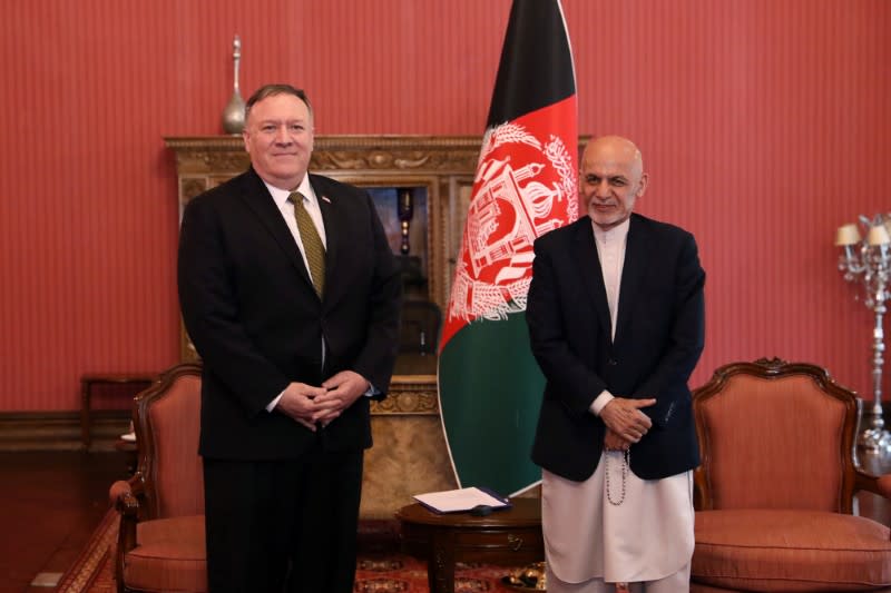 Afghanistan's President Ashraf Ghani and U.S. Secretary of State Mike Pompeo, pose for a photo during their meeting in Kabul