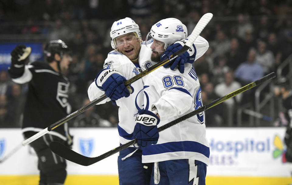 Tampa Bay Lightning right wing Nikita Kucherov, right, of Russia, is congratulated by center Steven Stamkos after scoring against the Los Angeles Kings during the first period of an NHL hockey game, Thursday, Nov. 9, 2017, in Los Angeles. (AP Photo/Michael Owen Baker)