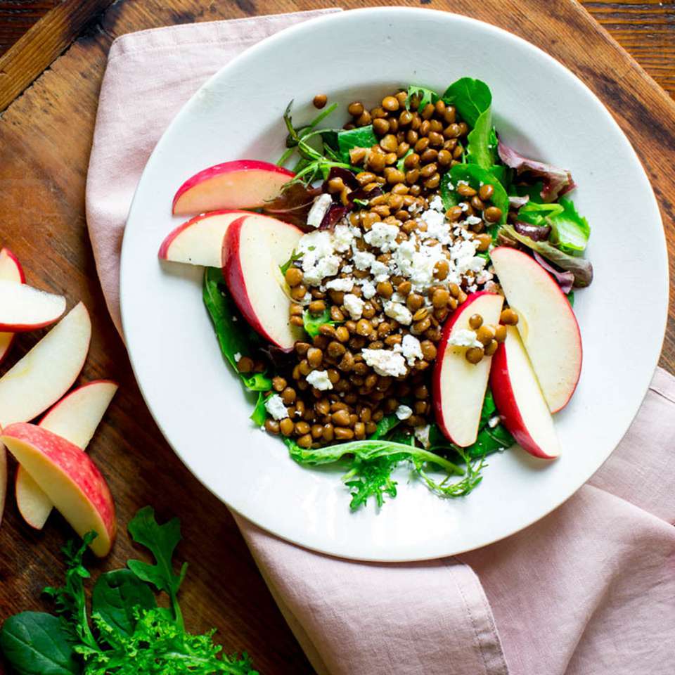 <p>This salad with lentils, feta and apple is a satisfying vegetarian entree to whip together for lunch. To save time, swap in drained canned lentils--just make sure to look for low-sodium and give them a rinse before adding them to the salad. <a href="https://www.eatingwell.com/recipe/259816/mixed-greens-with-lentils-sliced-apple/" rel="nofollow noopener" target="_blank" data-ylk="slk:View Recipe" class="link ">View Recipe</a></p>