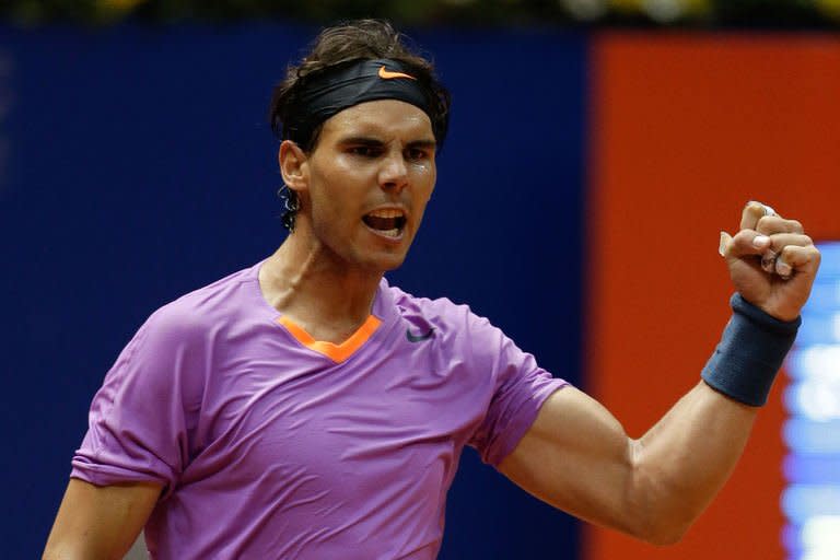 Spanish tennis player Rafael Nadal celebrates after defeating Argentinian Carlos Berlocq during the Brazil Open at Ibirapuera gymnasium in Sao Paulo, Brazil, on February 15, 2013. The 26-year-old Spaniard, ranked number five in the world, won 3-6, 6-4, 6-4 in two hours 24 minutes against the 30-year-old Argentine, ranked 78th in the world