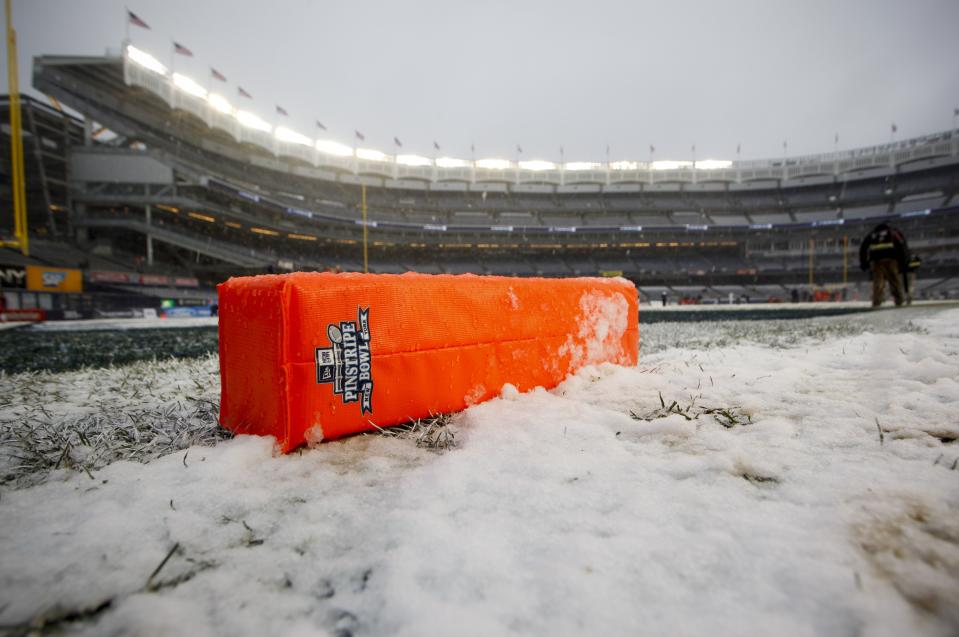 NEW YORK, NY - DECEMBER 29: A goal marker lies in the snow before the New Era Pinstripe Bowl between West Virginia Mountaineers and the Syracuse Orange at Yankee Stadium on December 29, 2012 in the Bronx borough of New York City. (Photo by Jeff Zelevansky/Getty Images)