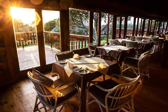 <p>Mark Ziembicki/Courtesy of andBeyond</p> The dining room at Mbotyi River Lodge, home base for sardine spotters.