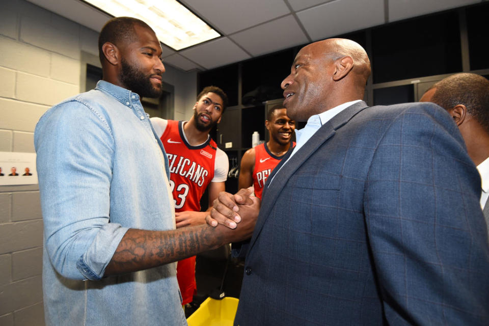 DeMarcus Cousins and Pelicans general manager Dell Demps shake hands after an April 2018 game against the Clippers. (Getty)