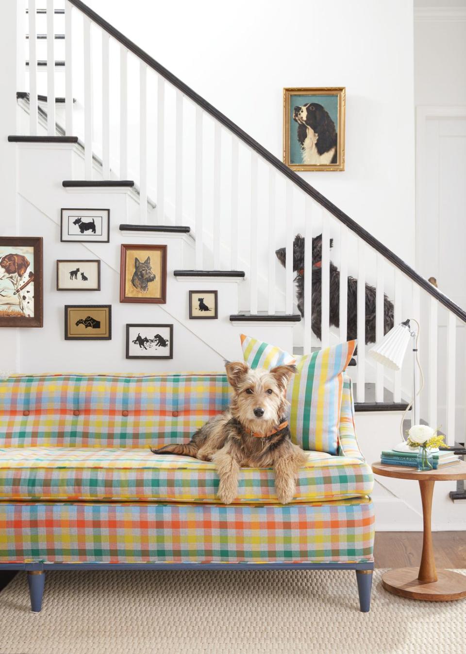 mid century bench sofa in front of stairs