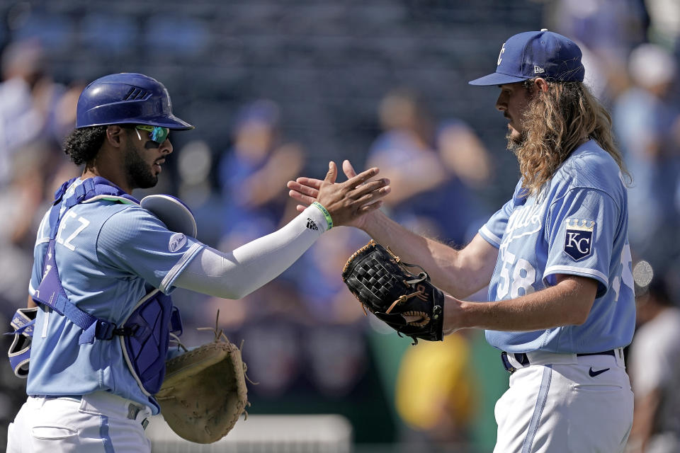 Kansas City Royals catcher MJ Melendez and relief pitcher Scott Barlow (58) celebrate after their baseball game against the Detroit Tigers Sunday, Sept. 11, 2022, in Kansas City, Mo. The Royals won 4-0. (AP Photo/Charlie Riedel)