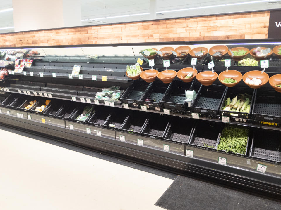 Picture of minimal food left in the vegetable aisle at the supermarket after panic buying