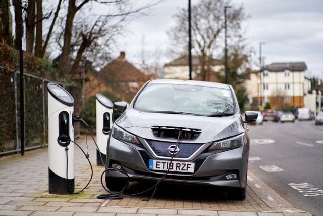 A Nissan Leaf electric car being charged in Isleworth, London (John Walton/PA)