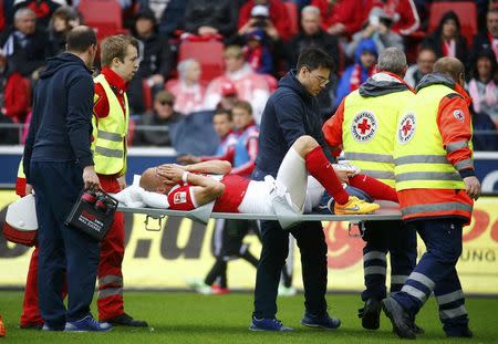 Medics carry FSV Mainz 05 Elkin Soto off the pitch after his collision with Hamburg SV's Rafael van der Vaart during their German first division Bundesliga soccer match in Mainz, Germany, May 3, 2015. REUTERS/Kai Pfaffenbach