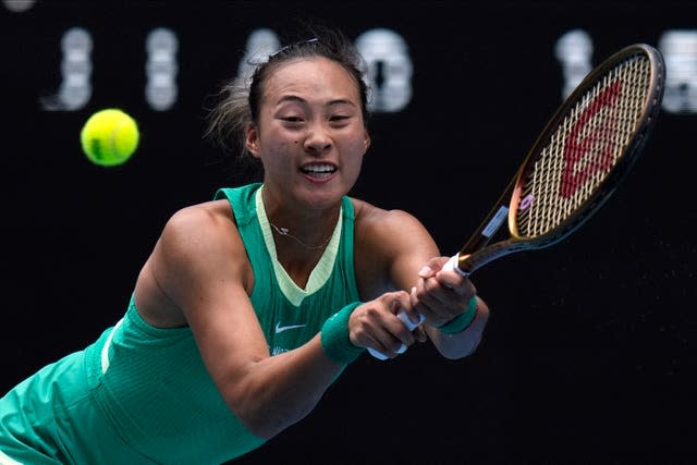 Zheng Qinwen plays a backhand