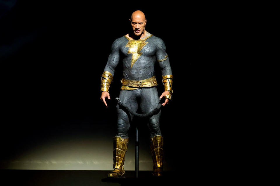 Dwayne Johnson speaks onstage at the Warner Bros. theatrical panel