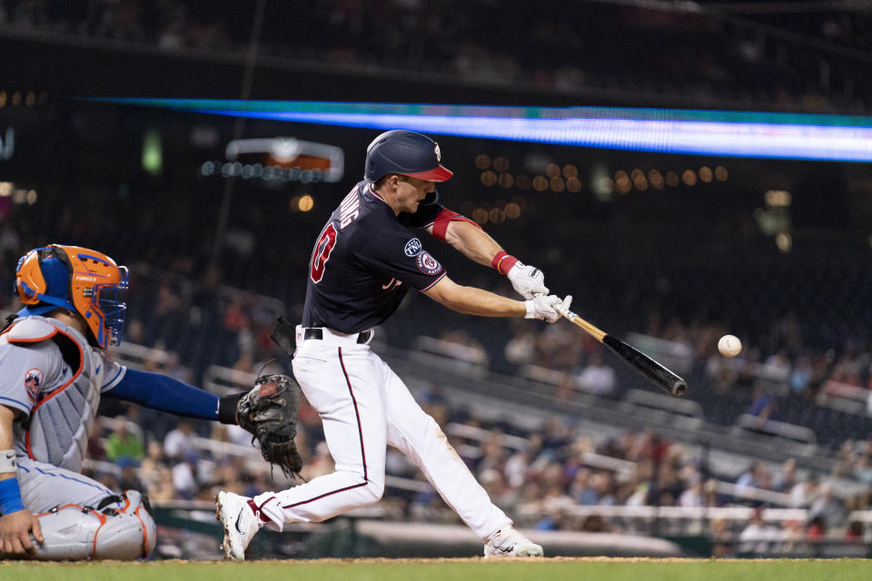 Washington Nationals' fielder Jacob Young hits an RBI single to score Nationals' Alex Call during the eighth inning of a baseball game against the New York Mets, Tuesday, Sept. 5, 2023, in Washington. (AP Photo/Stephanie Scarbrough)