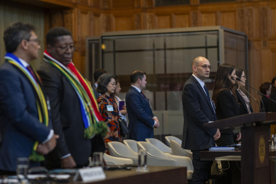 Front row from left, South Africa's agents Cornelius Scholtz, Vusimuzi Madonsela and Israel's agents Gilad Naom, Tamar Kaplan Tourgeman and co-agent Avigail Frisch Ben Avraham wait for the start of hearings at the International Court of Justice, in The Hague, Netherlands, Thursday, May 16, 2024. The U.N.'s top court opened two days of hearings in a case brought by South Africa to see whether Israel needs to take additional measures to alleviate the suffering in war-ravaged Gaza. (AP Photo/Peter Dejong)