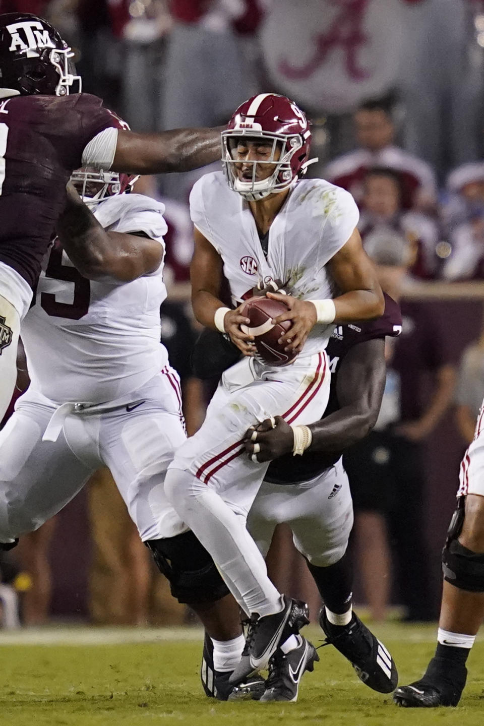 Texas A&M defensive lineman Tyree Johnson, rear, sacks Alabama quarterback Bryce Young during the first half of an NCAA college football game on Saturday, Oct. 9, 2021, in College Station, Texas. (AP Photo/Sam Craft)