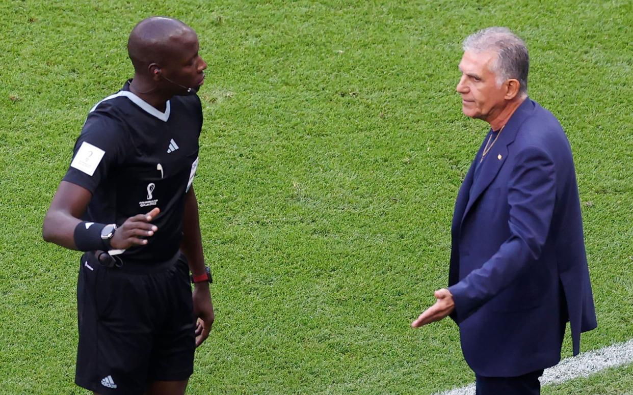 The fourth official Maguette Ndiaye talks to Iran head coach Carlos Queiroz (R) during the FIFA World Cup 2022 group B soccer match between Wales and Iran at Ahmad bin Ali Stadium in Doha - Rungroj Yongrit/EPA