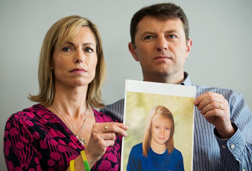 Parents of missing girl Madeleine McCann, Kate (L) and Gerry McCann (R) pose with an artist's impression of how their daughter might look now at the age of nine ahead of a press conference in central London, 2012 five years after Madeleine's disappearance while on a family holiday in Portugal. 