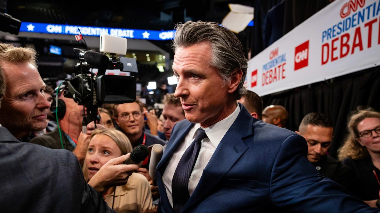  California Gov. Gavin Newsom (D) speaks to reporters during the Biden/Trump presidential debate. . 