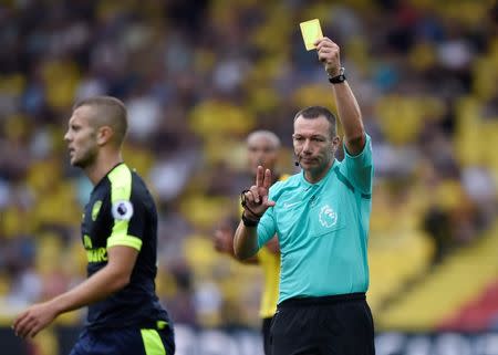 Football Soccer Britain - Watford v Arsenal - Premier League - Vicarage Road - 27/8/16 Arsenal's Jack Wilshere is shown a yellow card by referee Kevin Friend Reuters / Hannah McKay Livepic