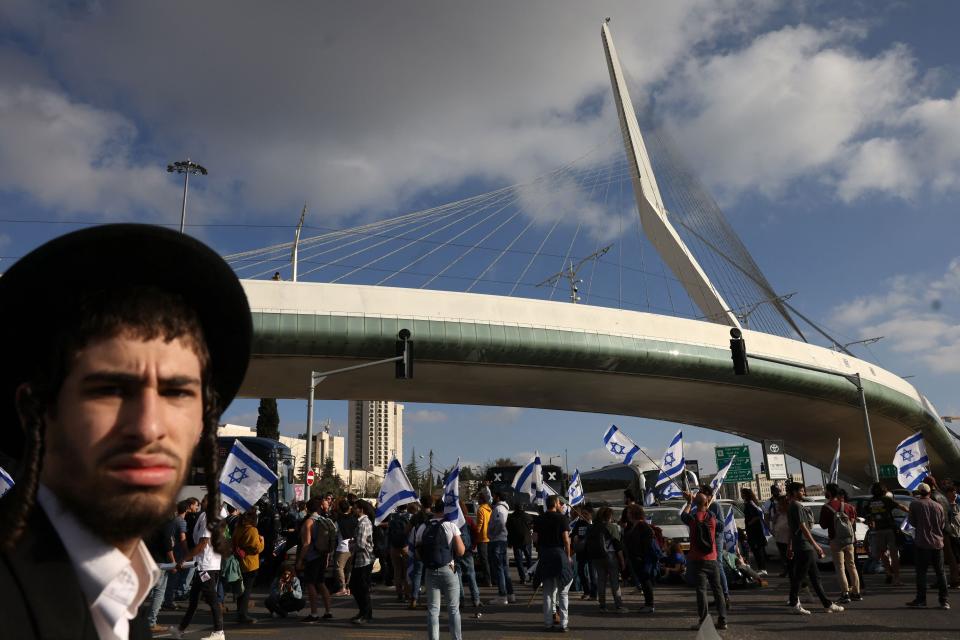 Protesters gather outside Israel's parliament in Jerusalem (AFP via Getty Images)