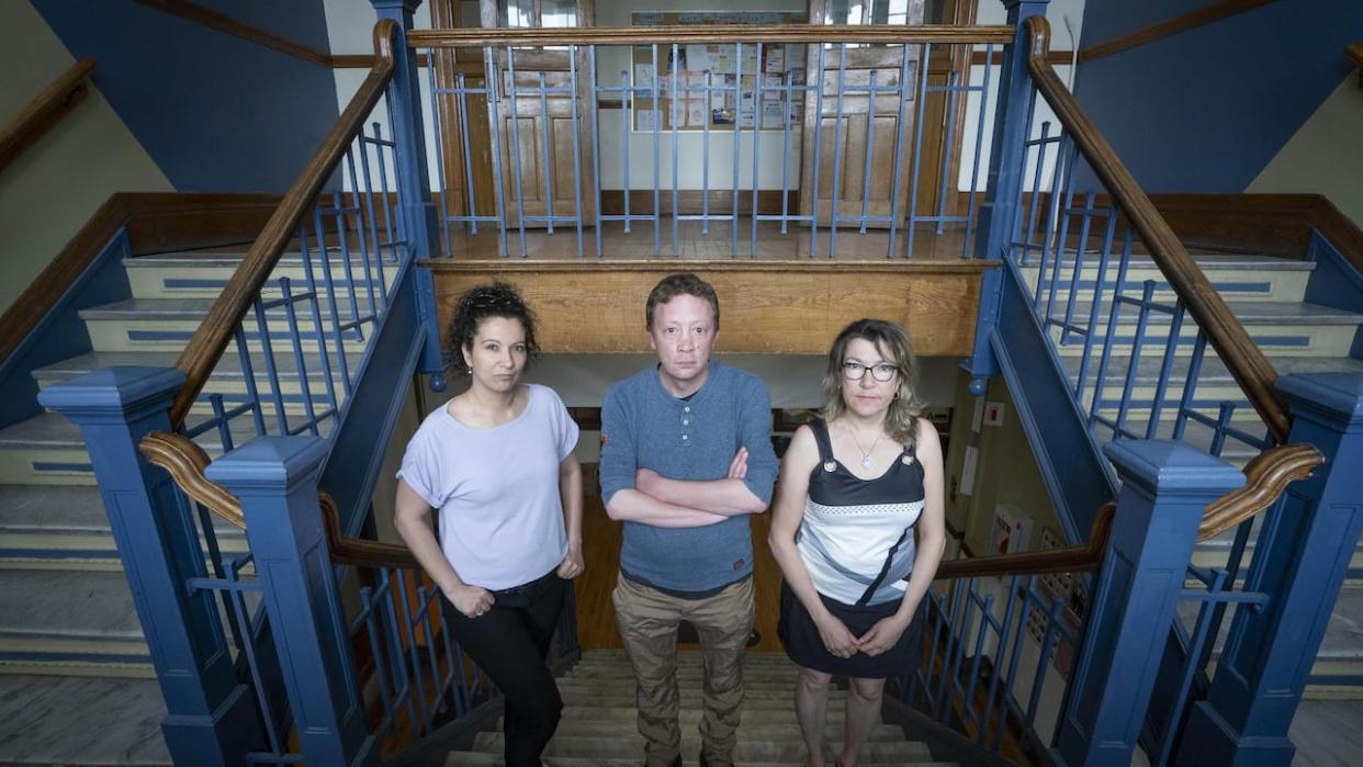 Myriam George, left, Rémy Robitalle, middle, and Chantal Comtois, right, are the heads of the Pause Famille, Solidarité Ahuntsic and the Service de nutrition et d'action communautaire (SNAC) organizations. Those three organizations are among 13 located in one address that are set to be evicted.  (Ivanoh Demers/Radio-Canada - image credit)