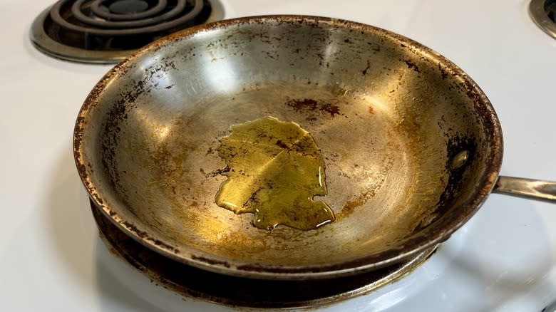 a stainless steel skillet with olive oil