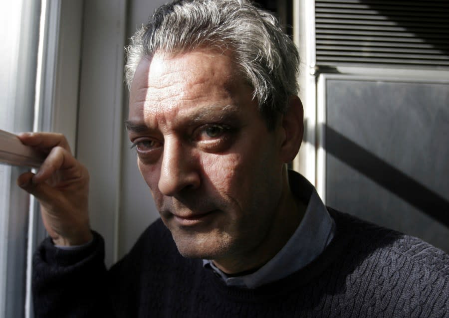 FILE – Writer Paul Auster poses at his home in the Brooklyn borough of New York, Jan. 19, 2006. Paul Auster, a prolific, prize-winning man of letters and filmmaker known for such inventive narratives and meta-narratives as “The New York Trilogy” and “4 3 2 1,” has died at age 77. (AP Photo/Bebeto Matthews, File)