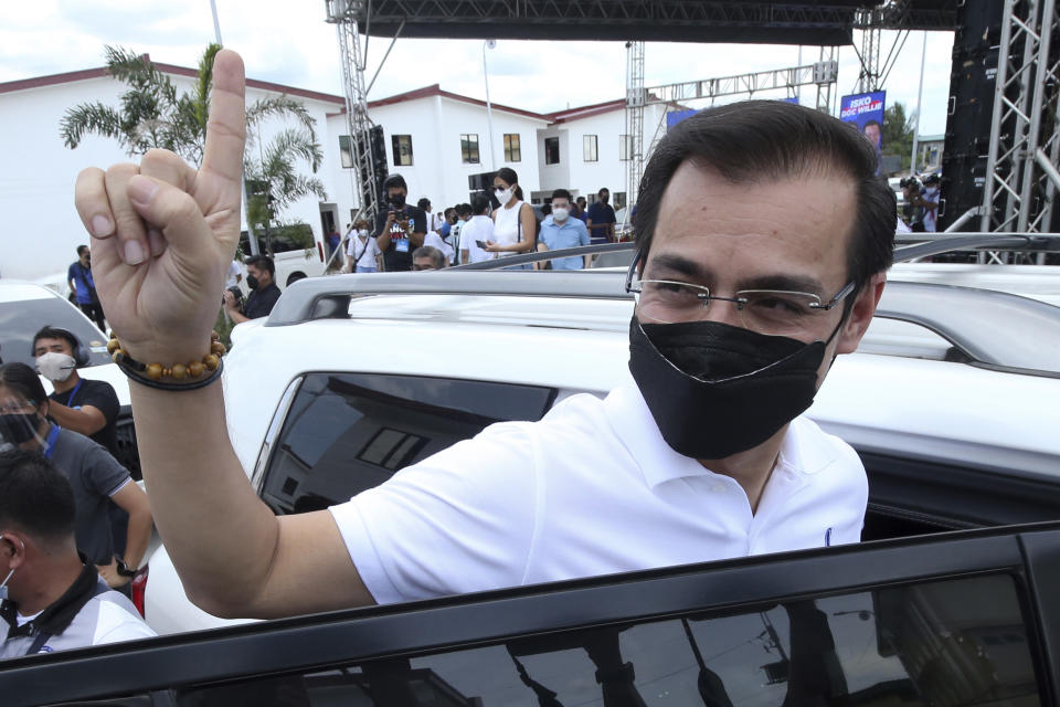 Manila Mayor Isko Moreno gestures after declaring his bid to run for president in a speech at a public school in the slum area near the place where he grew up in Manila, Philippines on Wednesday Sept. 22, 2021. The popular mayor of the Philippine capital said Wednesday he will run for president in next year's elections, the latest aspirant in what is expected to be a crowded race to succeed the controversial Rodrigo Duterte. (AP Photo)