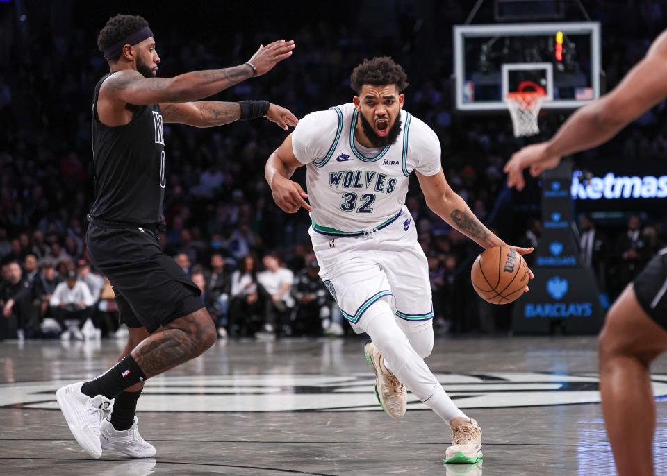 Jan 25, 2024; Brooklyn, New York, USA; Minnesota Timberwolves center Karl-Anthony Towns (32) dribbles against Brooklyn Nets forward Dariq Whitehead (0) during the second half at Barclays Center. Mandatory Credit: Vincent Carchietta-USA TODAY Sports