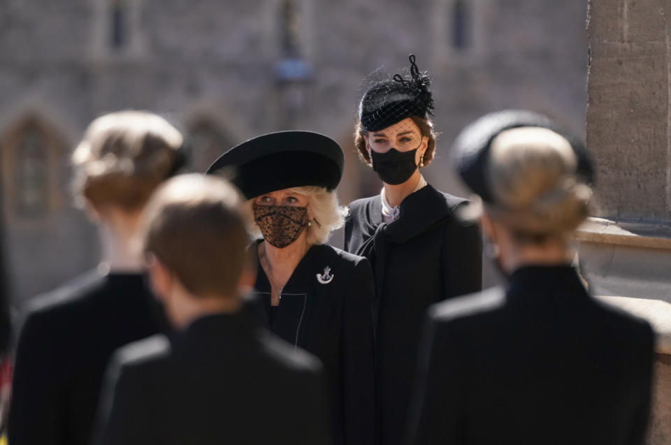 WINDSOR, ENGLAND - APRIL 17: Camilla, Duchess of Cornwall and Catherine, Duchess of Cambridge arrive for the funeral of Prince Philip, Duke of Edinburgh at St George's Chapel at Windsor Castle on April 17, 2021 in Windsor, England. Prince Philip of Greece and Denmark was born 10 June 1921, in Greece. He served in the British Royal Navy and fought in WWII. He married the then Princess Elizabeth on 20 November 1947 and was created Duke of Edinburgh, Earl of Merioneth, and Baron Greenwich by King VI. He served as Prince Consort to Queen Elizabeth II until his death on April 9 2021, months short of his 100th birthday. His funeral takes place today at Windsor Castle with only 30 guests invited due to Coronavirus pandemic restrictions. (Photo by Victoria Jones - WPA Pool/Getty Images)