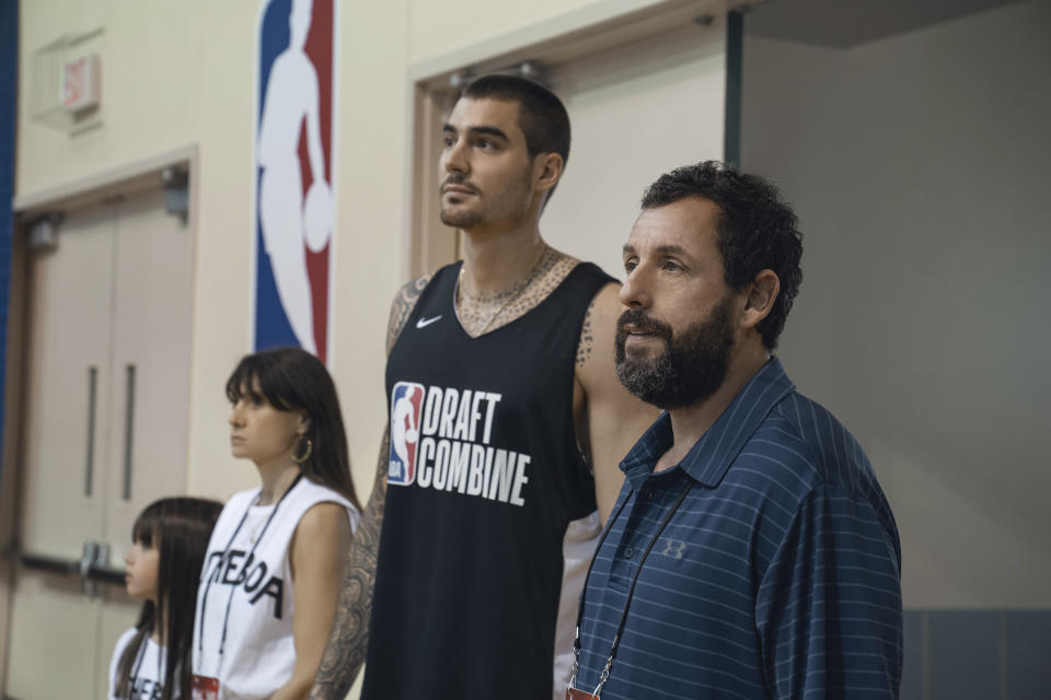 This image released by Netflix shows Ainhoa Pillet, from left, Maria Botto, Juancho Hernangomez and Adam Sandler in a scene from "Hustle." (Scott Yamano/Netflix via AP)