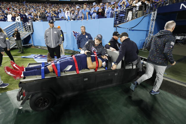 Tennessee Titans offensive tackle Taylor Lewan gives the thumbs up sign as  he is taken off the field after being injured against the Buffalo Bills in  the first half of an NFL