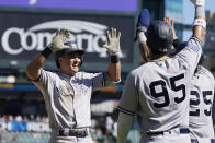 New York Yankees' Anthony Volpe is greeted by teammates after a three-run home run during the ninth inning of a baseball game against the New York Yankees, Thursday, Aug. 31, 2023, in Detroit. (AP Photo/Carlos Osorio)