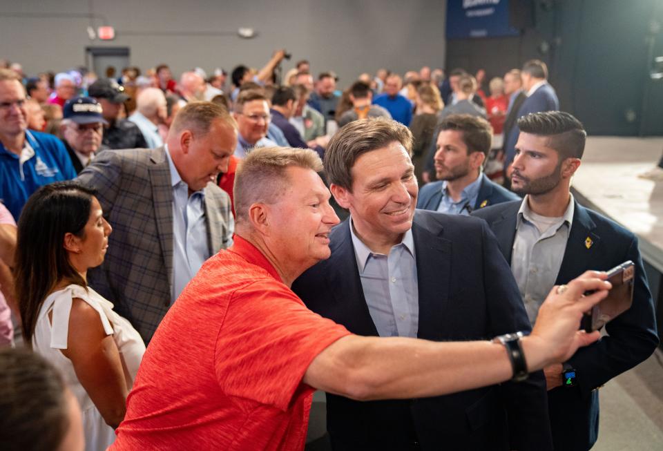 Republican presidential candidate Florida Gov. Ron DeSantis greets audience members during a campaign event in Clive, Tuesday, May 30, 2023. 