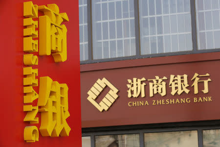 FILE PHOTO: A signboard of China Zheshang Bank is seen at its branch in Beijing, China, March 14, 2016. REUTERS/Kim Kyung-Hoon/File Photo