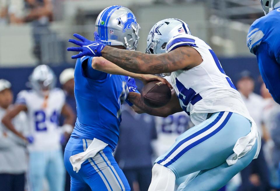 Dallas Cowboys defensive end Sam Williams strips the ball from Detroit Lions quarterback Jared Goff and recovers the fumble during the second half at AT&T Stadium, Oct. 23, 2022 in Arlington, Texas.