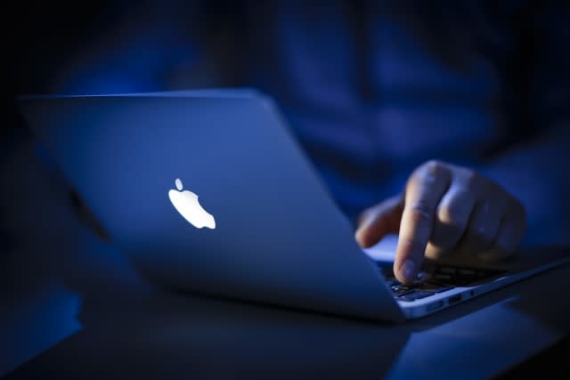 BERLIN, GERMANY - JUNE 22: In this photo Illustration the logo of Apple lights on an Apple Macbook Air on June 22, 2016 in Berlin, Germany. (Photo Illustration by Thomas Trutschel/Photothek via Getty Images)