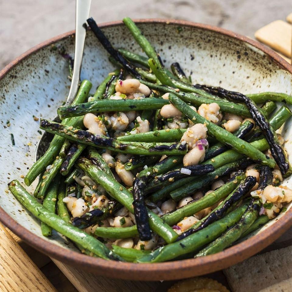 <p>Charred green beans pair perfectly with a light white bean salad. </p><p>Get the <strong><a href="https://www.womansday.com/food-recipes/a36902905/grilled-green-bean-salad-recipe/" rel="nofollow noopener" target="_blank" data-ylk="slk:Grilled Green Bean Salad recipe;elm:context_link;itc:0;sec:content-canvas" class="link ">Grilled Green Bean Salad recipe</a></strong>. </p><p><a class="link " href="https://www.amazon.com/Amazon-Brand-Happy-Sesame-Ounces/dp/B07VYPWBQ8?tag=syn-yahoo-20&ascsubtag=%5Bartid%7C10070.g.2641%5Bsrc%7Cyahoo-us" rel="nofollow noopener" target="_blank" data-ylk="slk:Shop Sesame Seeds;elm:context_link;itc:0;sec:content-canvas">Shop Sesame Seeds</a><br></p>