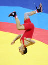 BEIJING - AUGUST 19: Radoslav Velikov of Bulgaria celebrates by doing a flip after defeating Namig Sevdimov of Azerbaijan in the bronze medal bout during the men's 55kg freestyle wrestling event at the China Agriculture University Gymnasium on Day 11 of the Beijing 2008 Olympic Games on August 19, 2008 in Beijing, China. (Photo by Jed Jacobsohn/Getty Images)