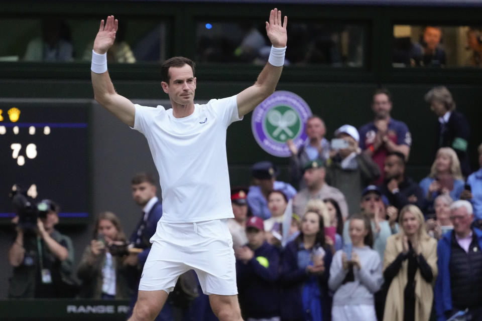 Britain's Andy Murray waves to the Center Court crowd as he leaves following his first round doubles loss at the Wimbledon tennis championships in London, Thursday, July 4, 2024. (AP Photo/Kirsty Wigglesworth)