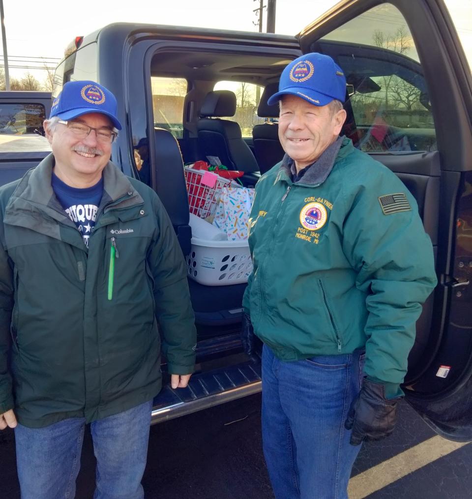 Jim Hario (father of Eric Hario KIA Afghan), left, and Jerry Heck (Army) participated in Christmas Drop Off, an Angels 4 Vets project designed to deliver food and gifts to local disabled and homebound veterans.