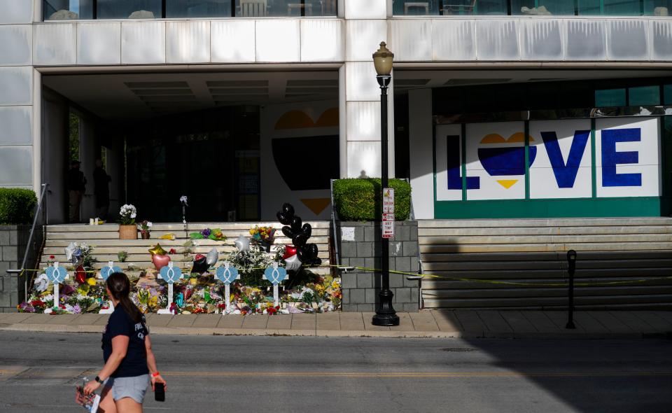 Five days after the mass shooting at Old National Bank where five people were shot and killed and nine injured by employee Connor Sturgeon in Louisville, Ky., flowers and the word LOVE on boarded-up windows are seen on Main Street downtown.  April 14, 2023