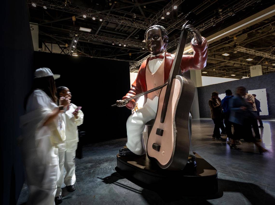 Miami Beach, Florida, December 6, 2023 - The Cellist by Artist Reginald O’Neal on display at Art Basel at the Miami Beach Convention Center during VIP day.