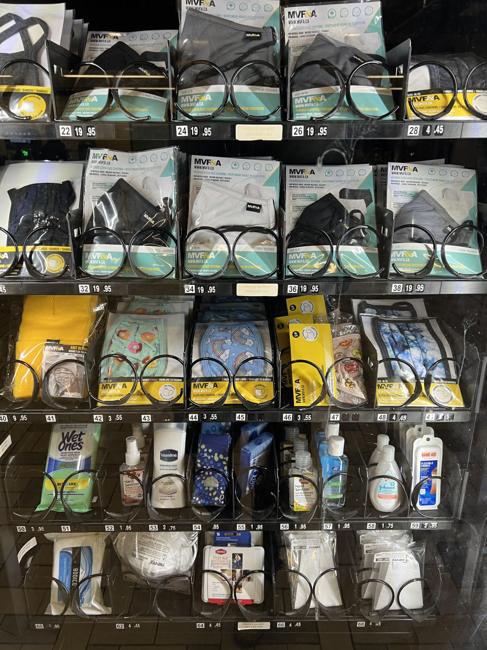 A display of various eyeglasses and contact lenses for sale on shelves