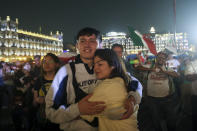 Supporters of ruling party presidential candidate Claudia Sheinbaum embrace after the polls closed during general elections at the Zocalo, Mexico City's main square, Sunday, June 2, 2024. (AP Photo/Ginnette Riquelme)