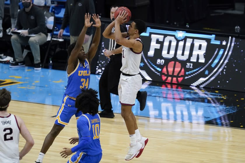 Gonzaga guard Jalen Suggs (1) shoots over UCLA guard David Singleton (34) to win the game during overtime.