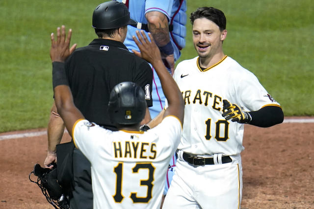 Pittsburgh Pirates' Bryan Reynolds (10) celebrates with Ke'Bryan Hayes (13) after they scored on Reynolds' inside-the-park home run off St. Louis Cardinals starting pitcher Matthew Liberatore during the fifth inning of a baseball game in Pittsburgh, Saturday, May 21, 2022. (AP Photo/Gene J. Puskar)